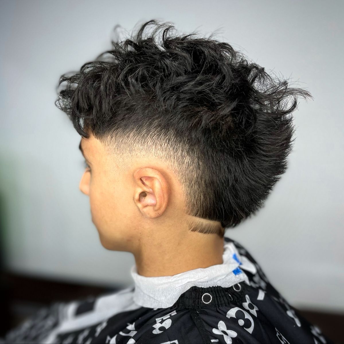 10 Best Burst Fade Mullet Curly Hair Style for Men 2024